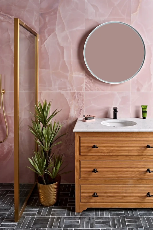 pink marbles wall tiles with wooden bathroom fixtures