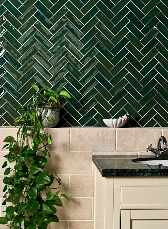 green wall tiles paired with stone bathroom tiles 