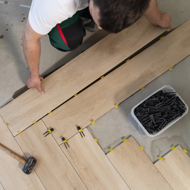 installing floor tiles